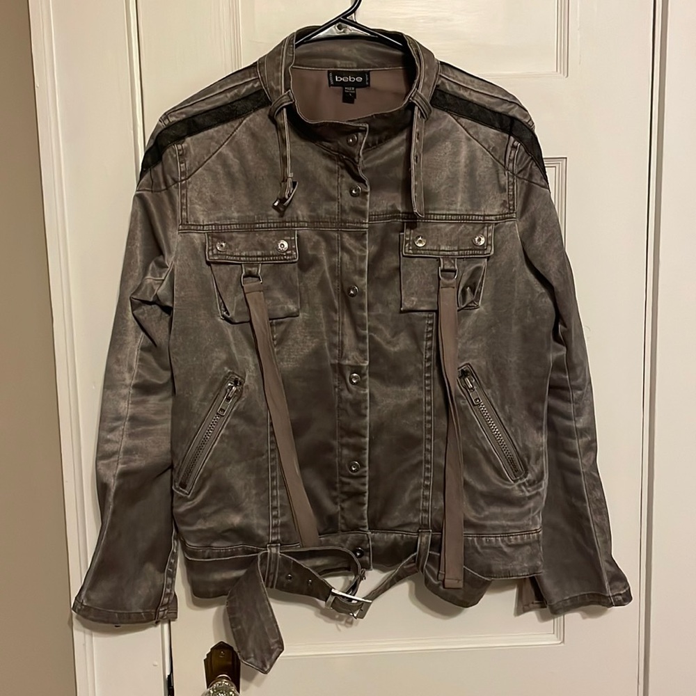 BEBE Cool vintage stretch moto jacket with buckles zippers and fringe